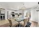 Bright kitchen featuring white cabinets, modern appliances, and an adjacent dining area with patio access at 204 Summer Pl, Norcross, GA 30071