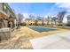 Outdoor community pool with a building and condos in the background at 204 Summer Pl, Norcross, GA 30071