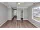 Neutral bedroom features an open closet, ceiling fan, and two windows for natural light at 2223 Wingate Sw St, Atlanta, GA 30310