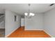 Bright dining room with tile floors and a modern chandelier, perfect for hosting dinner parties at 2223 Wingate Sw St, Atlanta, GA 30310