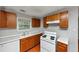 Traditional kitchen featuring wooden cabinets, white countertops, and essential appliances at 2223 Wingate Sw St, Atlanta, GA 30310