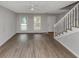 Inviting living room featuring new floors, natural light, and a staircase to the second floor at 2223 Wingate Sw St, Atlanta, GA 30310