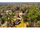 An aerial view of the home surrounded by dense trees, displaying the spacious lot and neighborhood setting at 4100 Brown Rd, Tucker, GA 30084