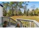 Expansive backyard view from the deck, featuring a lush lawn and mature trees offering a serene outdoor space at 4100 Brown Rd, Tucker, GA 30084