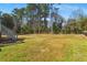 Wide shot of the spacious backyard, highlighting its ample green space perfect for recreation and outdoor activities at 4100 Brown Rd, Tucker, GA 30084