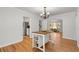 Bright dining area with hardwood floors and a view into kitchen for an inviting space at 4100 Brown Rd, Tucker, GA 30084