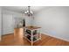 Dining area with hardwood floors, chandelier, and island bar for an inviting space at 4100 Brown Rd, Tucker, GA 30084