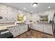 Updated kitchen featuring stone countertops, neutral backsplash and lots of cabinets at 4100 Brown Rd, Tucker, GA 30084