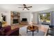 Cozy living room with fireplace, wood floors, and sliding door leading to outdoor deck at 4100 Brown Rd, Tucker, GA 30084