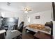 Cozy bedroom featuring a large bed, ceiling fan, and a dedicated gaming setup at 5968 Eagle Tiff Ln, Sugar Hill, GA 30518