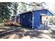 Exterior view of a blue home featuring a wooden deck, carport and a fenced-in backyard at 810 Gettysburg Trl, Kennesaw, GA 30144