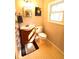 Bathroom with a white sink and wood cabinet at 810 Gettysburg Trl, Kennesaw, GA 30144