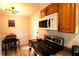 Galley kitchen featuring stainless steel appliances, butcher block countertops, and dining area at 810 Gettysburg Trl, Kennesaw, GA 30144