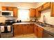 Modern kitchen featuring updated stainless steel appliances and light wood cabinets at 810 Gettysburg Trl, Kennesaw, GA 30144