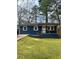 Charming blue house featuring a well-manicured lawn and inviting front porch at 1889 Cannon St, Decatur, GA 30032