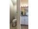 Modern bathroom featuring a toilet and vanity with granite countertop at 2075 Crabapple Parc Way, Roswell, GA 30076