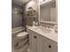 Well-lit bathroom with a modern vanity, stylish fixtures, and tiled shower with tub combination at 2075 Crabapple Parc Way, Roswell, GA 30076