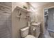 Bathroom vanity, tiled shower, toilet and view into hall, offering comfort and convenience at 2075 Crabapple Parc Way, Roswell, GA 30076