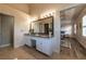 Bathroom boasts a spacious vanity with granite countertop and decorative lighting at 2075 Crabapple Parc Way, Roswell, GA 30076