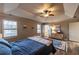 Bedroom featuring tray ceilings, ceiling fan, wood flooring, and natural light from windows at 2075 Crabapple Parc Way, Roswell, GA 30076