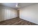 Bedroom featuring wood laminate flooring, closets and a sunny window at 2075 Crabapple Parc Way, Roswell, GA 30076