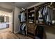 Spacious closet with custom storage solutions and a view of the bath at 2075 Crabapple Parc Way, Roswell, GA 30076