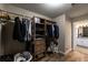 Well-organized walk-in closet with shelving and hanging space at 2075 Crabapple Parc Way, Roswell, GA 30076