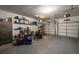 Spacious two-car garage with storage shelving and ample space for vehicles and projects at 2075 Crabapple Parc Way, Roswell, GA 30076