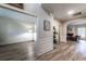 View of the hall that connects to a living room and empty room, features include hardwood floors and white wall trim at 2075 Crabapple Parc Way, Roswell, GA 30076