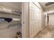 Hallway with linen closet and storage solutions at 2075 Crabapple Parc Way, Roswell, GA 30076