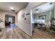 View of the hall that connects to an office and living room, features include hardwood floors and white wall trim at 2075 Crabapple Parc Way, Roswell, GA 30076