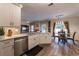 Bright, open-concept kitchen with stainless steel appliances and adjacent dining area at 2075 Crabapple Parc Way, Roswell, GA 30076