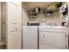 Laundry room features a modern washer and dryer at 2075 Crabapple Parc Way, Roswell, GA 30076