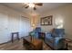 Bright living room featuring comfortable seating, wood floors, and a closet for storage at 2075 Crabapple Parc Way, Roswell, GA 30076