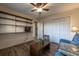 Inviting living space with built-in shelves, wood flooring, and comfortable blue seating, ideal for entertainment at 2075 Crabapple Parc Way, Roswell, GA 30076