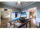 Bright home office featuring a large desk, dual monitors and a relaxing view at 2075 Crabapple Parc Way, Roswell, GA 30076