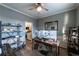 Inviting home office space with wood floors, two monitors and a view into the kitchen at 2075 Crabapple Parc Way, Roswell, GA 30076
