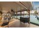 Enjoy outdoor tennis court viewing from the covered patio with ceiling fans, tables and chairs with a bar area at 2075 Crabapple Parc Way, Roswell, GA 30076