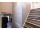 Hardwood staircase leading to upper level, with view to living room and fireplace at 2075 Crabapple Parc Way, Roswell, GA 30076