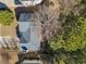 A high-angle view shows the roof and nearby trees at 239 Taylors Farm Dr, Canton, GA 30115