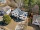 An aerial view of a charming home with an inviting driveway and beautiful landscaping at 239 Taylors Farm Dr, Canton, GA 30115
