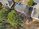 An aerial shot showcases roof details and surrounding foliage at 239 Taylors Farm Dr, Canton, GA 30115