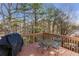 Back deck overlooking wooded area with a grill, perfect for outdoor cooking at 239 Taylors Farm Dr, Canton, GA 30115