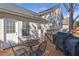 Back deck with a grill and seating area, providing a great space for outdoor entertaining at 239 Taylors Farm Dr, Canton, GA 30115