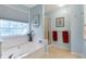 Bright bathroom featuring a soaking tub and separate shower at 239 Taylors Farm Dr, Canton, GA 30115
