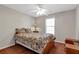 Bedroom featuring queen bed, window, dresser, and ceiling fan at 239 Taylors Farm Dr, Canton, GA 30115