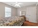 Bedroom featuring queen bed, window, dresser, and ceiling fan at 239 Taylors Farm Dr, Canton, GA 30115