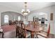 Elegant dining room with seamless flow into the living room and kitchen at 239 Taylors Farm Dr, Canton, GA 30115