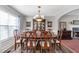 Traditional dining room with a fireplace and a large, elegant dining table at 239 Taylors Farm Dr, Canton, GA 30115