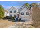 Charming two-story home with a well-manicured lawn and inviting curb appeal at 239 Taylors Farm Dr, Canton, GA 30115